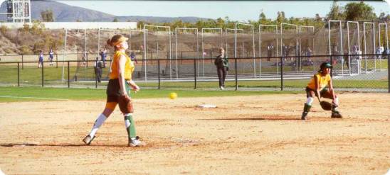 Picture of Brittany pitching and Chelsea ready to field